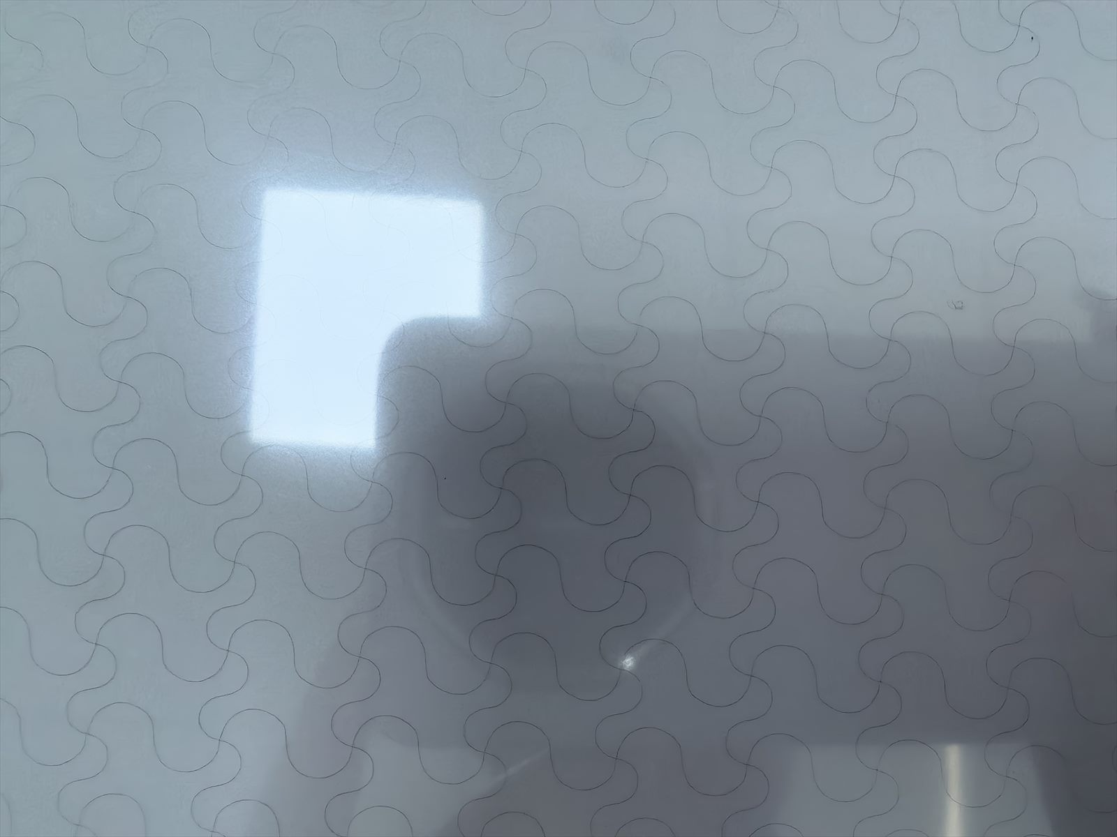 Close-up of DRWO ultra-fine-wire pattern on transparent functional film during production